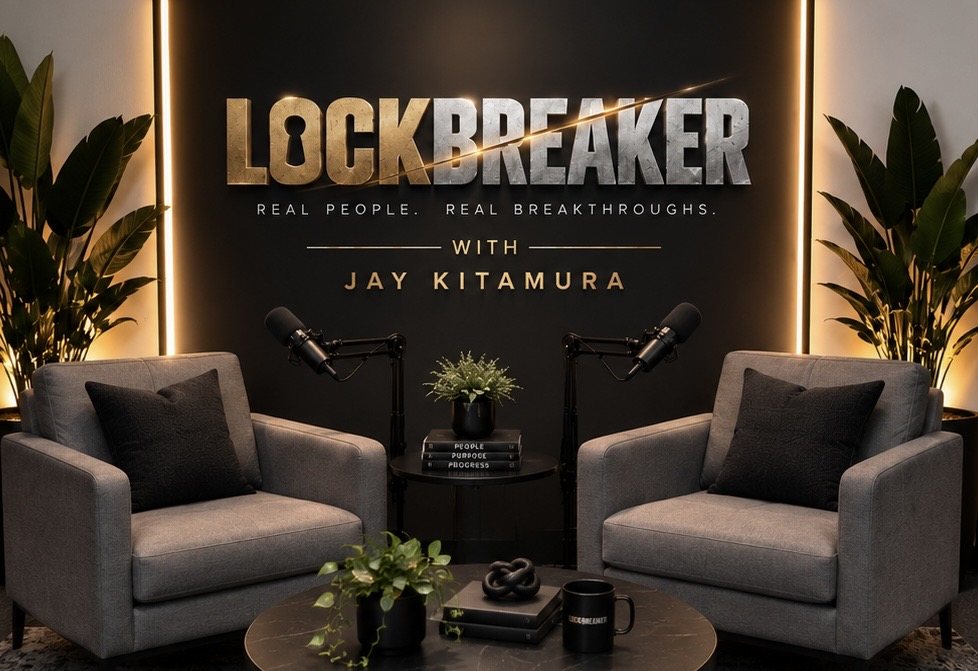 The LOCKBREAKER set: two grey armchairs facing each other under the gold LOCKBREAKER sign.